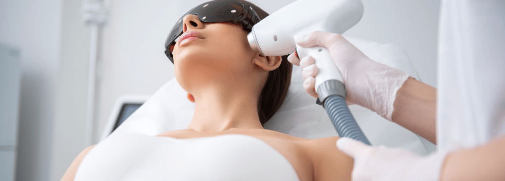 woman receiving laser skincare therapy to treat uv damage
