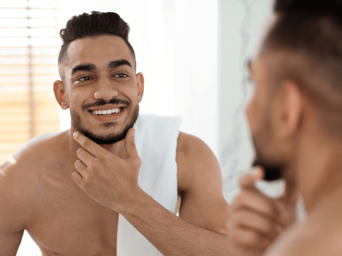 man lookin at self in mirror