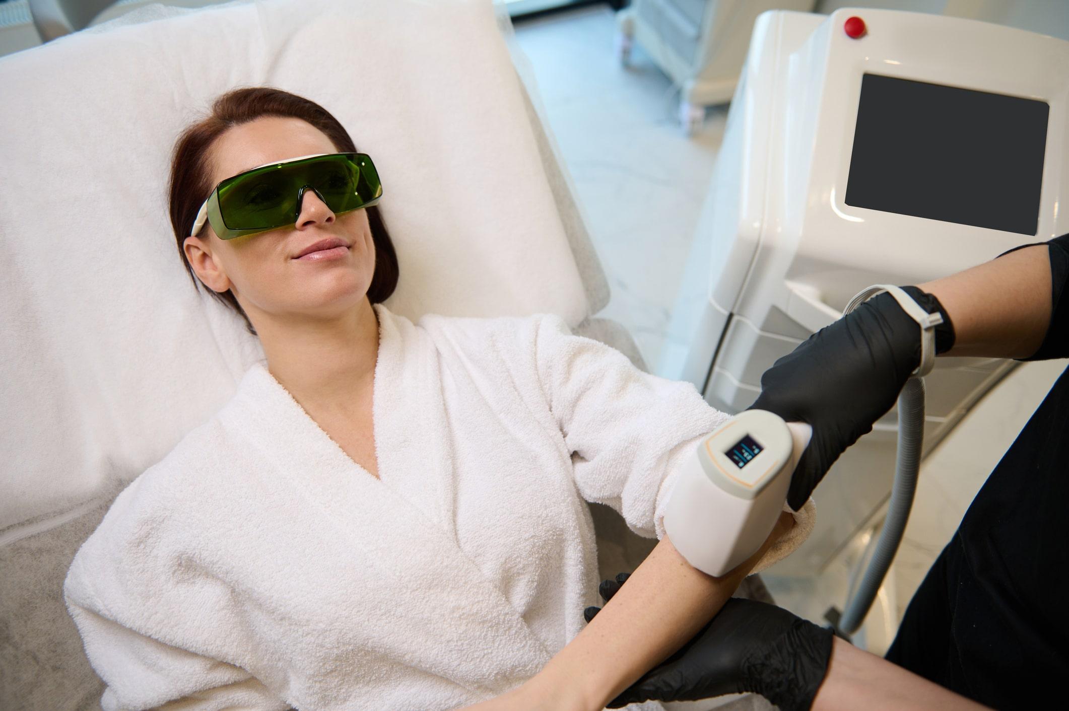 A female patient getting broad band light treatment